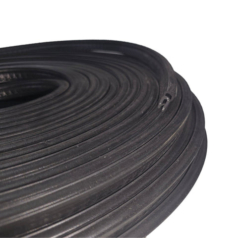 Coiled black rubber hose on a white background